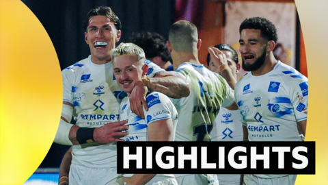 Toulouse players, in white kit, celebrate a try during their win at Wakefield