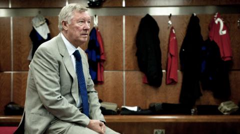 Sir Alex Ferguson in the home dressing room at Old Trafford for Paul Scholes' testimonial match in August 2011