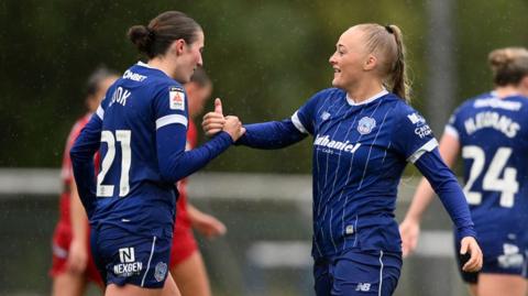 Cardiff City's Mikayla Cook (L) celebrates scoring a goal