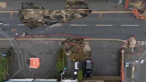 An aerial view of the sinkholes that have opened in the centre of Godstone.