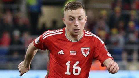 Joe Morrell playing for Wales