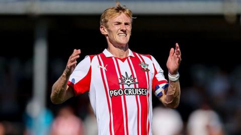 Flynn Downes in action for Southampton in his red and white top