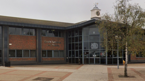 A red brick and glass court building