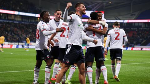 Bolton's John McAtee, scorer of the third goal against Mansfield, celebrates the second goal scored by Victor Adeboyejo