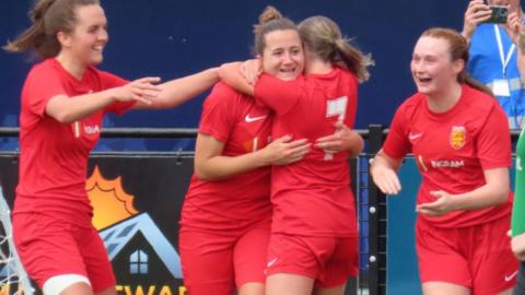 Jersey celebrate scoring a goal