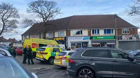 A road blocked by emergency services in Oldbury