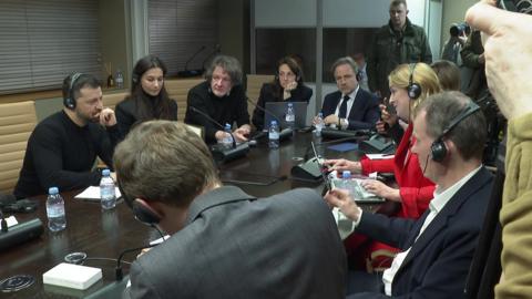 Zelensky surrounded by members of the press, including the BBC's Laura Kuenssberg, at a press conference a