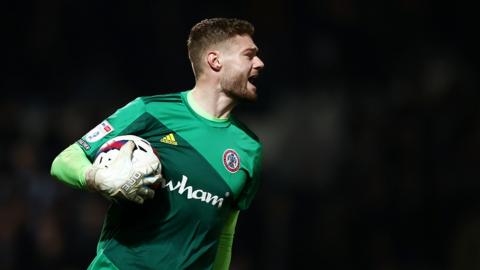 Accrington goalkeeper Lukas Jensen