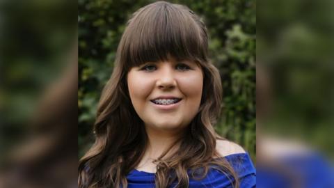 Mariella Rose has long brown hair and braces on her teeth and is wearing a blue top. She is smiling warmly at the camera.