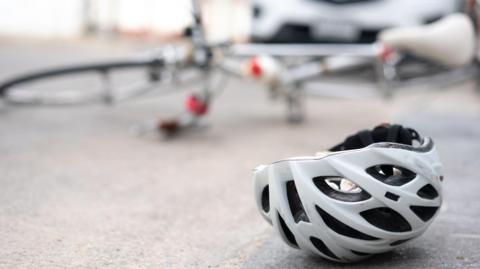 A bike and helmet in a road