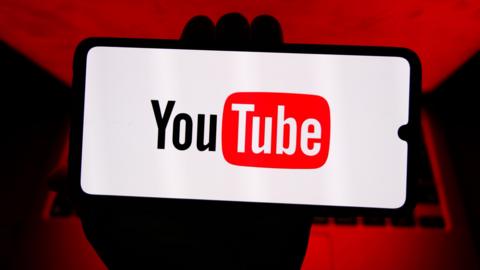 The YouTube logo, as seen on a smartphone