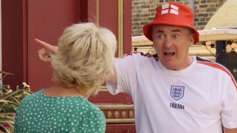 Alfie Moon in England football paraphenalia on East Enders