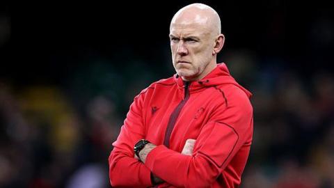 Wales coach Steve Tandy watches his side warm up