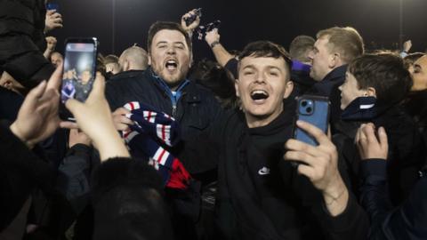Dundee fans celebrate promotion to the Scottish Premiership