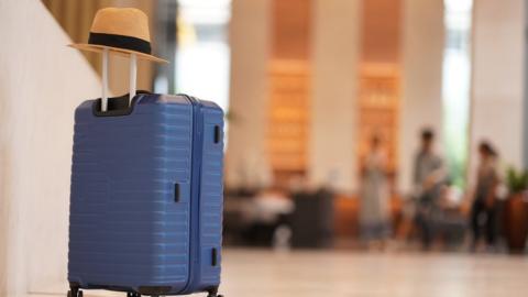 A suitcase in a hotel lobby