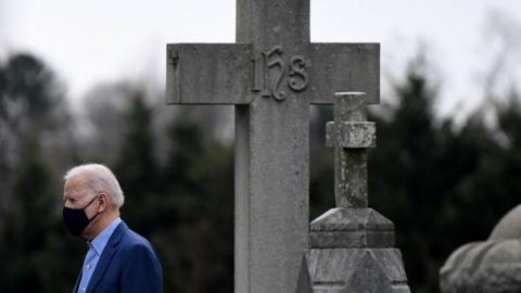 Biden and a giant cross