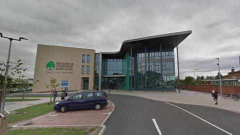 Newark and Sherwood Council headquarters - a modern building viewed from the car park