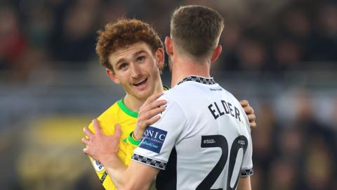 Josh Sargent of Norwich City stands dejected with Callum Elder of Derby County