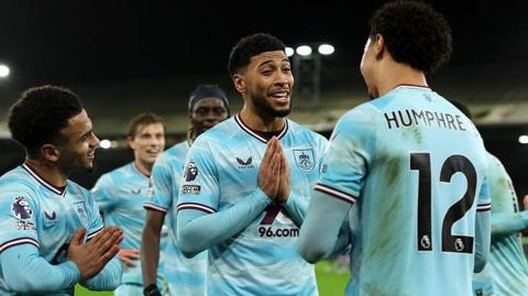 Burnley celebrate scoring against Crystal Palace in the Premier League