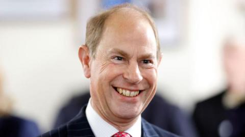 A close-up of the Duke of Edinburgh, who has receding dark blond hair and fluffy eyebrows