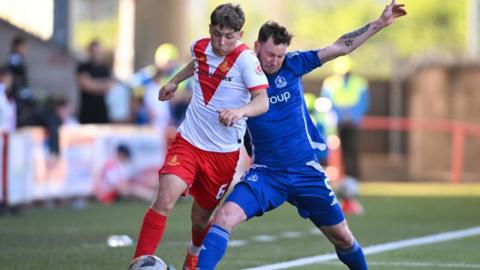 Airdrieonians Dean McMaster and Cove Rangers' Mitch Megginson in action during a William Hill Championship Play-Off Final Second Leg match between Airdrieonians and Cove Rangers at the Albert Bartlett Stadium