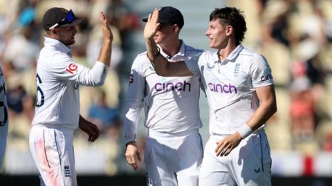 England players celebrate a wicket