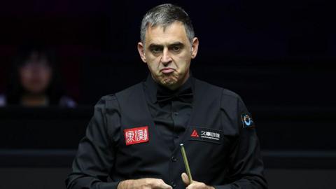 Ronnie O'Sullivan grimaces during his first-round win over Liu Linhao at the 2026 Shanghai Masters