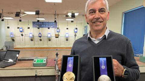Paul Guillou shows off his World Games medals back in Guernsey