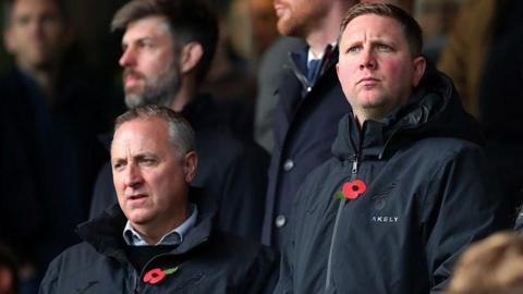 Neil Adams and Ben Knapper in the stands at Carrow Road