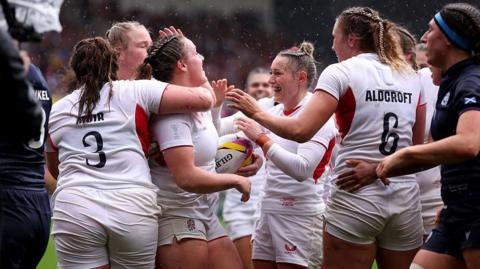 England players celebrate a try
