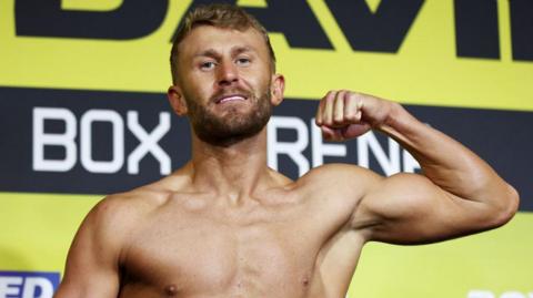 Boxer Lewis Edmondson poses for a photo at a weigh in 