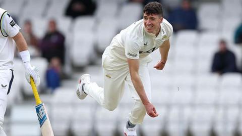Surrey bowler Matt Fisher in action