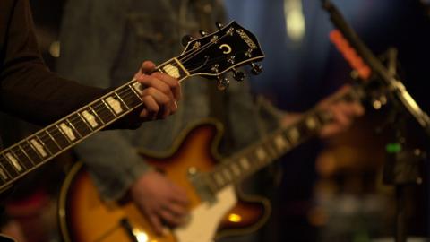 Guitarists playing music