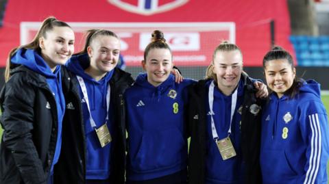 Northern Ireland players pose for a photo 