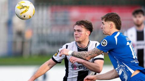 Penybont's James Crole in action against Flint Town's Jack Thorn