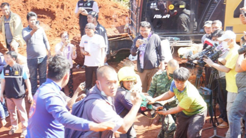 Rescue workers carrying the child on a stretcher