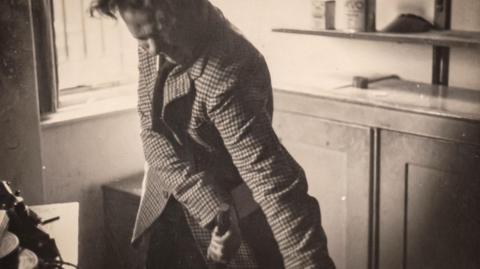 Dylan Thomas pictured in a rage with a cigarette in his mouth