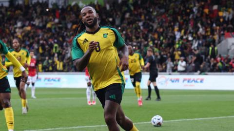 Kasey Palmer celebrates scoring first goal for Jamaica