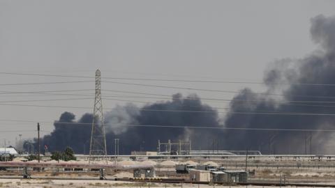 Smoke is seen following a fire at Aramco facility in the eastern city of Abqaiq