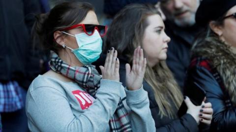 A Rugby fan wearing a facemask