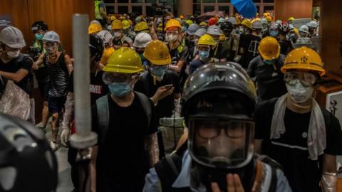Protesters break into the Legislative Council Complex in July 2019