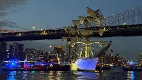 A Mexican Navy ship is seen after crashing into the Brooklyn Bridge