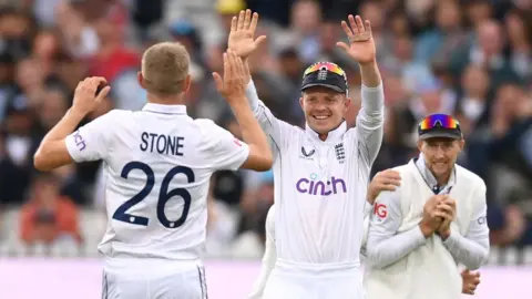 England players celebrate a wicket