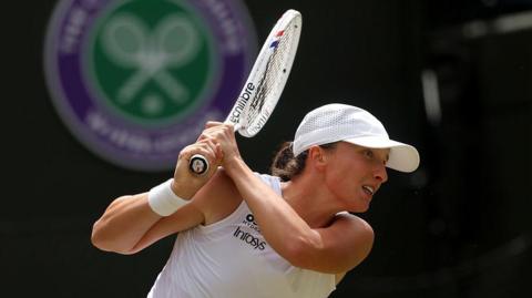 Iga Swiatek in action at Wimbledon