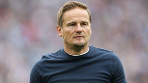 Neal Ardley looks on