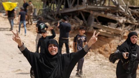 Displaced people cross a bridge linking southern Lebanon to the rest of the country. The bridge in Qasmiyeh has been badly damaged by an Israeli air strike. Photo: 17 April 2026