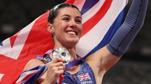 Amy Hunt celebrates after winning world 200m silver in Tokyo in September