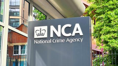 The National Crime Agency (NCA) signage outside the headquarters in London