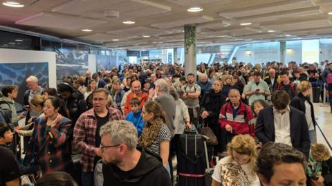 Hundreds of people waiting inside Gare du Nord station