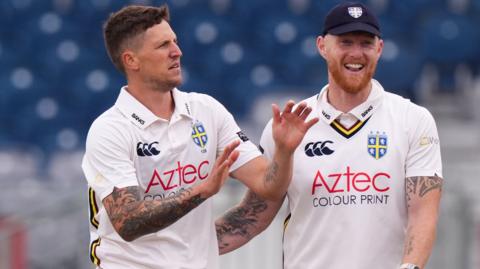 Durham's Brydon Carse celebrates the wicket of Gloucestershire's Joe Phillips (not pictured) with Ben Stokes on day one of the Rothesay County Championship Division 2 match at Banks Homes Riverside, Chester-le-Street